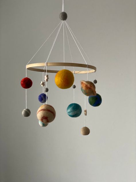 Solar system mobile  are ideal as a décor for a children's room. Baby mobile add that perfect final touch to your new little one's nursery. Gorgeous, delicate and light crib mobile will for sure be the focal centerpiece of your nursery or any other room in your house . This  felted mobile is perfect decoration for a baby girl nursery room. It will surely become a wonderful design item in your kid's room. Baby mobile is first wonderful present for your baby or if you want  make the ideal baby sho Colorful Mobile, Diy Space Nursery Decor, Baby Present, Baby Mobiles, Mobile Baby, Crib With Mobile, Baby Mobile Diy, Space Nursery Mobile, Planets Mobile Solar System