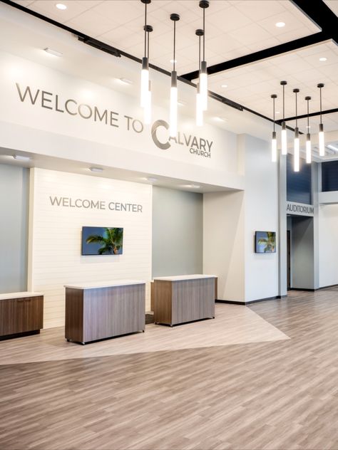 Calvary Church in Jupiter Farms, FL designed by Equip Studio. Interior photo of primary lobby. Welcome Desk Church, Church Reception, Small Church Lobby Design, Church Information Center, Welcome Center, Church Lobby Ideas, Welcome Center Church Ideas, Church Sanctuary Design, Church Sanctuary