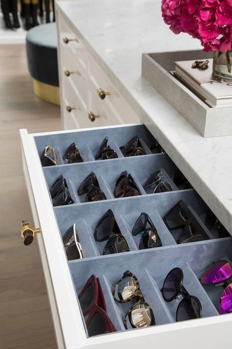 A white closet island drawer accented with a gray glass and brass knob opens to reveal a blue velvet sunglass organizer fitted beneath a marble countertop. Storage Tricks, Chic Closet, Closet Island, White Closet, Dream Closet Design, Drawer Inserts, Closet Decor, Dream Closets, Organize Drawers