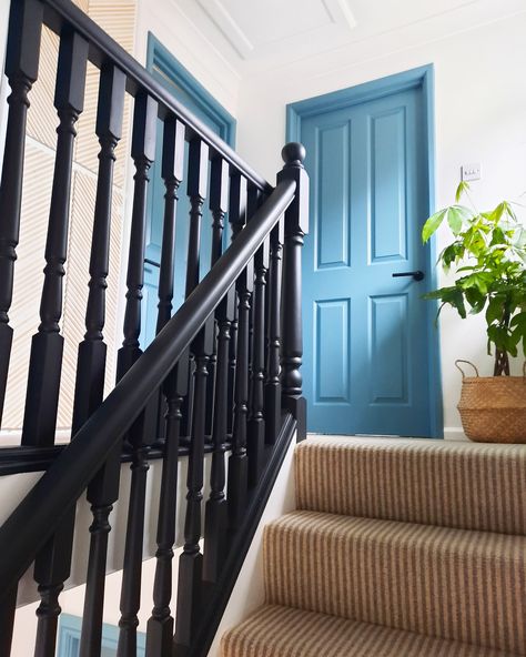 Create an eye-catching design by painting your doors and frames a bold colour. Doors and frames painted in Farrow and Ball Stone Blue and banister and spindles painted in a mix of Frenchic Aftermidnight and Blackjack. Navy Blue Bannister, Navy Banister Stairways, Blue Bannister, Navy Bannister Rail, Frenchic Painted Stairs, Painted Handrails For Stairs Colour, Blue Staircase, Blue Banisters, Blue Stair Bannister