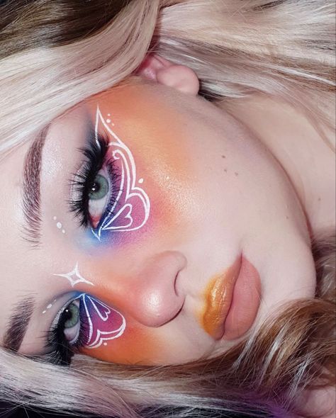 butterfly eye makeup, eyeshadow art, pink eyeshadow, blue eyeshadow, purple eyeshadow, orange eyeshadow, white eyeliner, eyeliner art Eyeshadow White Eyeliner, Butterfly Makeup Look, Butterfly Eye Makeup, Eyeliner Art, Eyeshadow Art, Eyeshadow Orange, Eyeshadow Purple, Pure Makeup, Eyeshadow Blue