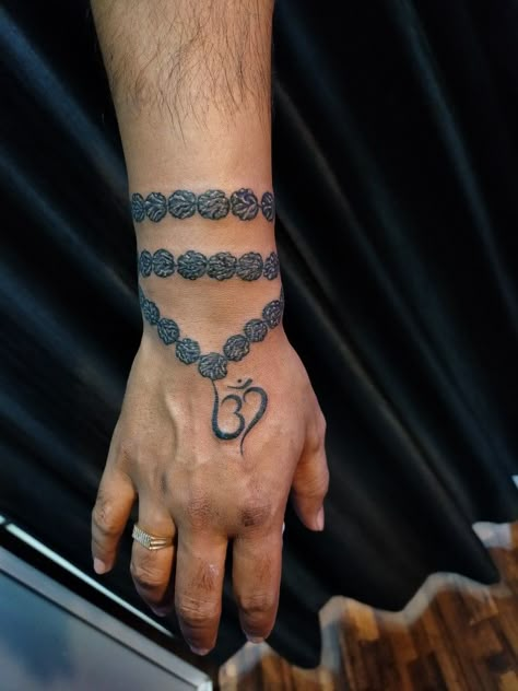 #Rudraksha tattoo designs #om tattoo designs #best tattoo studio #raipur chhattisgarh #9589557355 Rudraksha Tattoo On Wrist, Rudraksh Tattoo Design, Rudraksha Tattoo Design, Om Tattoo Men, Prayer Beads Tattoo, Rudraksha Tattoo, Om Tattoo Designs, Beads Tattoo, Baby Murugan Paintings