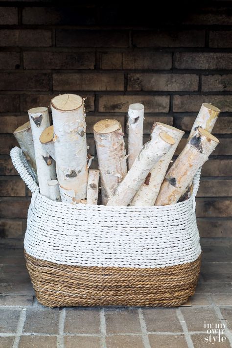 Bundle of birch logs in large basket in fireplace is an easy way to decorate the inside of an unused fireplace in a room. Fireplace Filler, Decorating With Natural Elements, Early Fall Decorating, Empty Fireplace Ideas, Unused Fireplace, Natural Fall Decor, Log Decor, Fireplace Baskets, Indoor Fall Decor