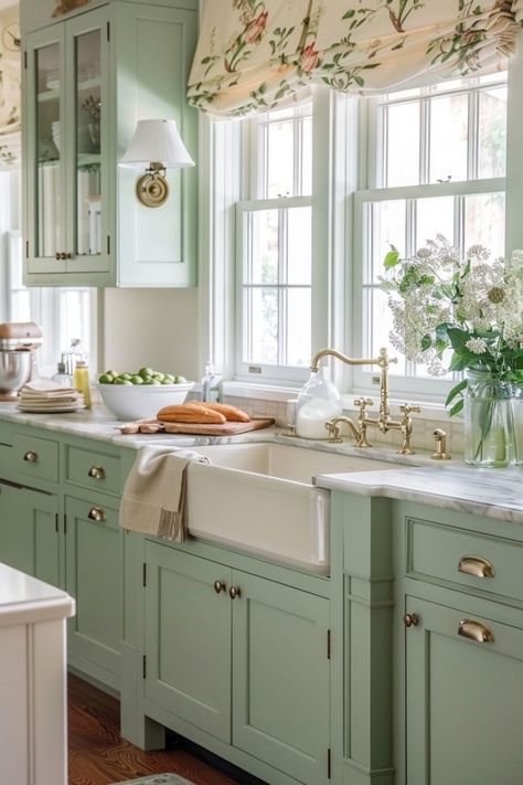 Dive into a world where color breathes life into the heart of your home with our green kitchen ideas. From the subtle elegance of sage to the depth of dark green, explore designs that harmonize farmhouse charm with cottage coziness and a touch of boho flair. Whether you're drawn to light green hues for a fresh, airy feel or richer tones for a more enveloping ambiance, find inspiration to create a kitchen that's both inviting and stylish. Cream And Green Kitchen Ideas, Light Sage Green Cabinets, Fairy Core Kitchen, Sage Green Country Kitchen, Sage Green Cottage Kitchen, Kitchen With Wall Of Windows, Safe Green Kitchens, Green Kitchen Cottage, Green Cupboards Kitchen