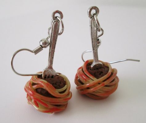 [Spaghetti and Meatball Earrings] These were handcrafted using nontoxic polymer clay measure around 1" from top to bottom. Wiring is made from hypoallergenic materials. Available as earrings and single charms. Charms are sold as individual pieces and will come with one jump ring attachment. Spaghetti Monster, Crazy Earrings, Flying Spaghetti Monster, Food Earrings, Etsy Stuff, Funky Earrings, Spaghetti And Meatballs, Sculpting Clay, Funky Jewelry