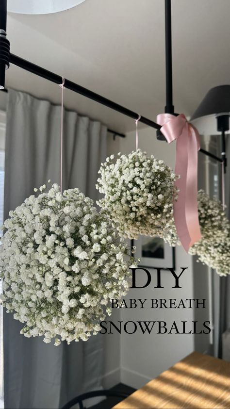 Tiffany Dalling | In my DIY era. Sharing how I made these baby breath snowballs for the cutest baby shower. Couldn’t be happier how they turned out. 💗 | Instagram Baby Shower Staircase Decor, January Baby Shower Themes, Baby Shower Clothesline, January Baby Shower, Winter Baby Shower Decorations, January Baby, Bridal Shower Decorations Diy, Garden Baby Showers, Garland Backdrops