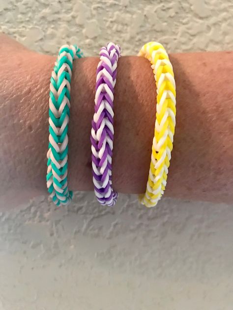 "Handmade loom bracelets! Sizes: Ages 2-5 - 4\" Ages 6- 9 - 6\" Ages 10+ - 7\" WARNING: May be a choking hazard for ages 3 and under My Cotton candy and Mermaid bracelets are my specialty, however I can create any colors that you desire such as school colors, baseball/football colors, holidays, or any other color combo. (See the last picture for colors.) I also do pink or blue for gender reveals!! 💙💖" Cute Loom Band Bracelet Ideas, Loom Bands Color Combos, Cool Loom Band Ideas, Cute Rubber Band Bracelet Color Ideas, Rainbow Loom Ideas Easy, Friendship Bracelets Loom Bands, Loom Bracelets Color Combos, Rainbow Loom Color Combinations, Rainbow Loom Bracelets Color Ideas