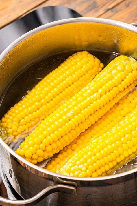 Corn on the cob is a summer staple and we are going to teach you how to make it perfectly, so it's tender, juicy and delicious. Tips and Tricks on How to Boil Corn on the Cob so you can enjoy it all summer long! #corn #recipe Boil Corn On Cob, How To Boil Corn, Corn Recipes Cob, Boil Corn On The Cob, How To Reheat Steak, Corn Stock, Fresh Corn On The Cob, Balsamic Steak, Yummy Summer Cocktails