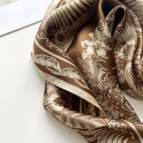 Effortlessly elevate your summer look with our bestseller silk bandana scarves! Versatile, chic, and comfortable, it's the perfect accessory to add a touch of sophistication and elegance to your everyday outfit. #LuluLaneUK #giftforherideas #ComfortInStyle #LittleLuxuries #ootdinspo #SilkLove #effortlesslychic #neckchief #womensneckwear #bandanastyle #parisianstyle #accessoryoftheday #datenightoutfit #scarfstyle #SophisticatedStyle #shoplocaluk Brown Silk Scarf, Silk Hair Scarf, Scarf Photography, Small Silk Scarf, Silk Scarf Hair, Pattern Weights, Magical Accessories, Silk Neck Scarf, Fern Leaves