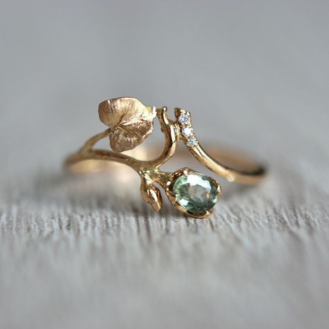 Truly romantic, delicate sapphire and diamond ring with the botanical motif of green flower bud and twig with leaves. This sapphire and diamond leaf wedding ring is handmade with special care for details. I created it with the thought of women who love nature, going to the woods, or hiking mountains.  And if you live far away from it, in a crowded city, the look at the jewelry piece will bring harmony to your life peace and quiet.   And a few details about the stone, material, shipping, and pack Fairy Inspired Wedding Rings, Engagement Rings Stones Not Diamond, Wedding Ring Nature Inspired, Plant Inspired Engagement Rings, No Traditional Wedding Rings, Plant Engagement Ring, Elven Engagement Rings, Cottagecore Rings Engagement, Four Leaf Clover Ring