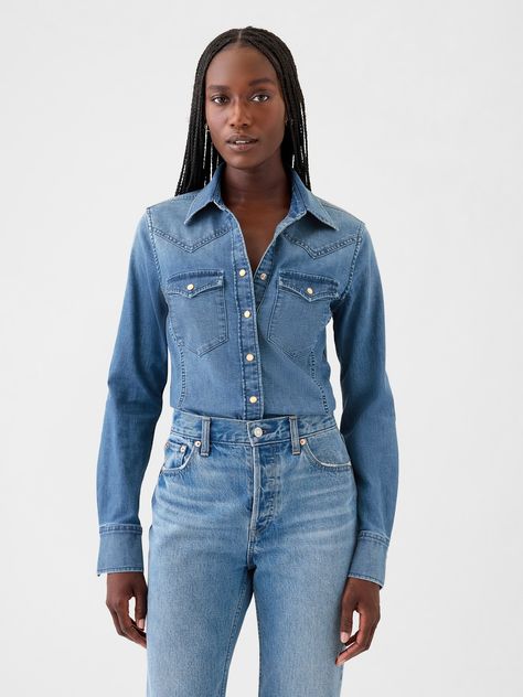 Soft, stretch denim shirt.  Point collar, snap button front.  Long sleeves.  Patch pockets at front.  Allover Western detailing.  Responsibly Made: This denim shirt is part of our water-saving Washwell program.  Compared with conventional wash methods, Washwell uses at least 20% less water and has saved over a billion liters of water since 2016.  More Sustainable Materials: This denim shirt is made with 17% recycled polyester and 5% recycled cotton.  Compared to virgin materials, using recycled materials helps to reduce resource use and waste.  Fit: Close to the body.  Hits at the hip.  Models wearing Gap Denim Shirt Outfit Women Fall, Denim Shirt Outfit Women, Denim Shirt Outfit, Denim Western Shirt, Nyc Fall, Western Denim Shirt, Women Shirt Top, Water Saving, Western Shirt