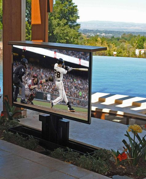 Awesome TV coming out of the planter in a beautiful backyard. Let's you watch TV outside while keeping your TV safe from weather. Outdoor Tv Screen, Outdoor Tv Setup, Tv Solutions, Swivel Tv Mount, Patio Tv, Outdoor Tv Cabinet, Art Facts, Classical Villa, Lawn Ideas