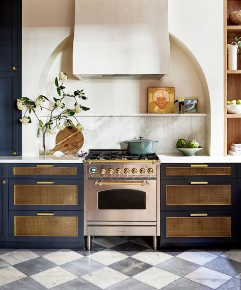 Mixing black and navy is only a faux pas in fashion. This kitchen proves the two hues can work together to create a stunning space with navy cabinets and black and white tile flooring. Purple Dining Room, Small Kitchen Renovations, Built In Cabinet, Wooden Kitchen Utensils, Black And White Tiles, Built In Furniture, Kitchen Photos, Stylish Kitchen, Back To Nature