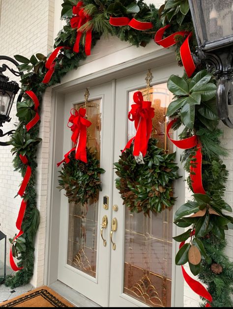 Christmas Wreaths For Double Front Door, Christmas Double Door Decor, Holiday Wreath Double Doors, Double Door Christmas Bow, Double Door Christmas Decor, Red Bow Front Door Christmas, Christmas In The South, 1930s Christmas, Front Door Garland