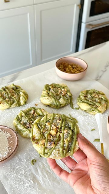 Maryam on Instagram: "PISTACHIO TWISTS/KNOTS•  You may have seen the Nutella version of these or even the Biscoff but I’m telling you- you have to try the PISTACHIO 💚  Add your own twist to it by layering walnuts inside, sprinkle them on top- or leave it out completely. The pistachio cream on its own is so delicious!   With only 5 ingredients- here’s another easy one. Pistachio cream linked in highlight “ingredients”  RECIPE: Set oven to 350 -one package puff pastry (2 sheets)  •roll out each sheet just a tiny bit -spread pistachio sweet cream on one sheet -put the second sheet on top -cut into strips (this made 10) -twist + roll. Make sure to tuck in ends -egg wash the tops -top with crushed walnuts (optional) -bake for 12-15 minutes  -sprinkle with powdered sugar  (optional drizzle of m Pistachio Puff Pastry Dessert, Pistachio Cream Cake, Ways To Use Pistachio Cream, Pistachio Puff Pastry, Pistachio Spread Uses, Pistachio Pastry Cream, Pistachio Croissant Filling, Pistachio Cream Filled Croissant, Pistachio Choux Pastry