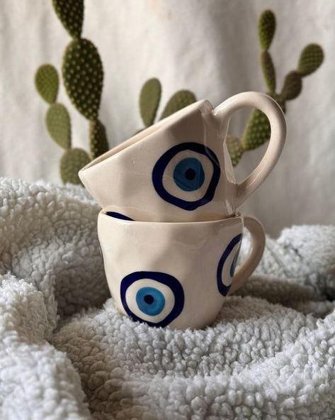 “✨ Sip in style and ward off negative vibes with our ceramic evil eye mug! Perfect for your morning coffee or evening tea. Grab yours today and protect your energy. 💙🧿 #EvilEyeMug #CeramicMagic #ShopNow” Mugs Painted, Evil Eye Mug, Ceramic Evil Eye, Pastel Home, Negative Vibes, Diy Pottery Painting, Printed Mugs, Protect Your Energy, Handmade Mugs