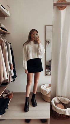 Mini Skirt Fashion Classy, Aritzia Black Mini Skirt, Black Mini Skirt Oversized Sweater, Black Mini Skort Styling, Check Mini Skirt Outfit Winter, Black Skirt Work Outfit Winter, How To Style Short Skirt In Winter, Outfits With Black Skirt Winter, Pencil Skirt And Sweater Outfit