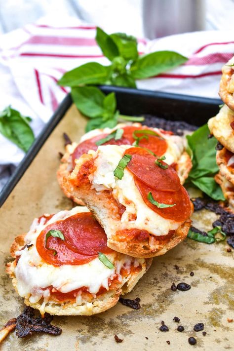 english muffin pizzas on a parchment paper lined baking sheet Pizza Flatbread, English Muffin Pizza, Pizza Muffins, After School Snack, Pizza Recipes Easy, Pizza Flavors, Kid Friendly Lunches, English Muffins, Flatbread Pizza