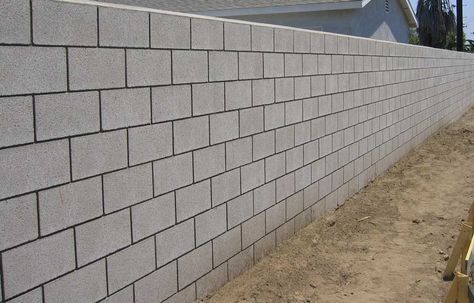 Calculate how many concrete blocks are needed for your wall or building project. Find how to estimate concrete block construction projects. Concrete Fence Wall, Cinder Block House, Concrete Block Retaining Wall, Concrete Masonry Unit, Fence Wall Design, Types Of Bricks, Compound Wall Design, Concrete Block Walls, Cinder Block Walls