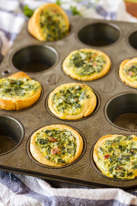 Mini Spinach Quiche -- these cute little mini quiche filled with spinach and bacon are a delicious and filling brunch idea! They’re also very tasty cold, making them an excellent on the go breakfast option… | easy mini spinach quiche | mini spinach quiche recipe | mini spinach quiche brunch | mini spinach quiche crescent rolls | find the recipe on unsophisticook.com Cold Quiche Recipes, Quiche Recipes Cupcake, Quiche Recipes Easy Muffin Pan, Cupcake Quiche Recipes, Cold Brunch Food Ideas, Cupcake Quiche, Luau Brunch, Mini Spinach Quiche, Quiche Cupcakes