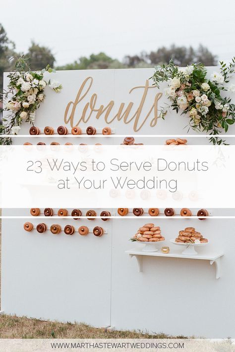 23 Ways to Serve Donuts at Your Wedding That Your Guests Will Love! These fun reception desserts are a creative alternative to classic wedding cake. #WeddingIdeas #WeddingFood #WddingDonuts #FunWeddingFood | Martha Stewart Weddings - 23 Delicious Ways to Serve Donuts at Your Wedding Donut Wall For Wedding Reception, Doughnut Dessert Table Wedding, Donut Reception Ideas, Donuts Instead Of Wedding Cake, Donuts Wall Wedding, Doughnut Table Ideas, Wedding Donut Bar Dessert Tables, Doughnut Wedding Cakes, Donuts Serving Ideas