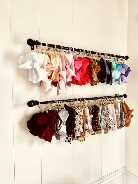 Bow Tie Organization Ideas, Bow Holder Nursery, How To Organize Bows, Curtain Rod Bow Holder, Nursery Headband Organization, Hanging Bows In Nursery, Diy Bow Storage, Onesie Storage Ideas, Baby Accessories Organization