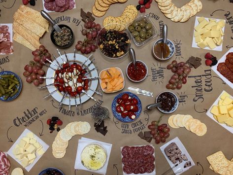 Large Charcuterie Board displayed on brown butcher paper Chalk Charcuterie Board, Grazing Table Brown Paper, Charcuterie Brown Paper, Charcuterie Board Ideas On Brown Paper, Grazing Table On Brown Paper, Charcuterie Board Ideas Butcher Paper, Craft Paper Charcuterie Table, Butcher Paper Tablecloth Party, Butcher Paper Food Display