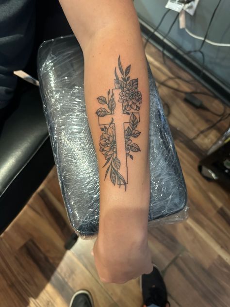 Zinnia flowers surrounding a cross Flowers Surrounding Words Tattoo, Bible Flowers Tattoo, Southern Flower Tattoo, Cute Back Of Arm Tattoos For Women, Flower And Bible Verse Tattoo, Flower Tattoos With Cross, Cross W Flowers Tattoo, Cross With Cherry Blossom Tattoo, Meaningful Country Tattoos