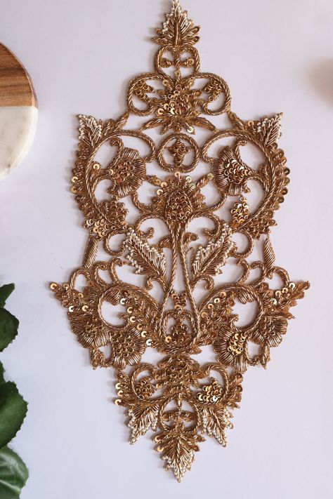 1 Pc. exquisite Golden Embroidered Applique Sew-On Patch. 🌸 Key Features 🌸 🌼 Intricate Embroidery: Our patch showcases intricate floral embroidery, featuring delicate details that elevate your attire to a whole new level of sophistication. 🌼 Sequin and Brass Accents: Shimmering sequins and brass embellishments are meticulously sewn onto the patch, creating a dazzling interplay of light and texture. 🌼 Versatile Application: Whether you're a seasoned designer or a DIY enthusiast, this sew-on Gold Machine Embroidery, Golden Embroidery Design, Embroidery Patches Designs, Gold Applique, Gold Work Embroidery, Simple Hand Embroidery Patterns, Zardozi Embroidery, Simple Blouse Designs, Sequin Patch