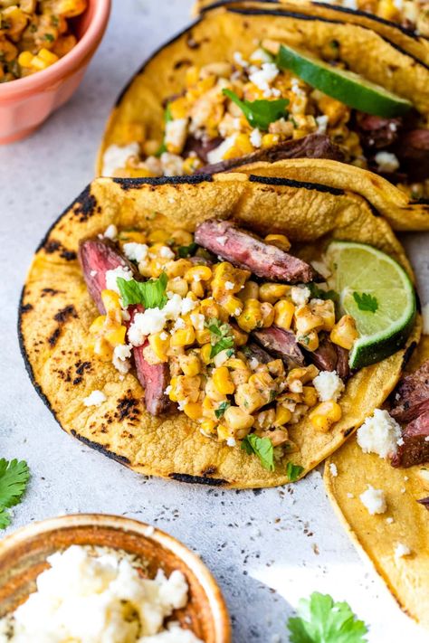 Grilled steak tacos topped with Mexican street corn is a match made in heaven for an easy summer dinner idea! #dinner #steak #tacos #grilling #summerrecipes #glutenfree #healthyrecipes #weightwatchers #fathersday Elote Tacos, Skirt Steak Tacos, Street Taco Recipe, Easy Summer Dinner, Grilled Skirt Steak, Dinner Steak, Grilled Taco, Vegan Paleo Recipes, Steak Tacos