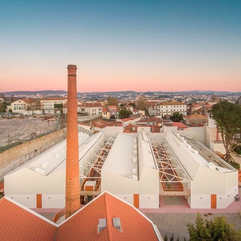 Image 17 of 39 from gallery of The New Life of Industrial Architecture in Cities: 20 Renovations and Conversions of Old Factories and Warehouses. António Granjo Mixed Use Complex / Fragmentos. Image © Fernando Guerra | FG+SG Industrial Factory Architecture, Old Factory Renovation, Warehouse Architecture, Warehouse Renovation, Industry Architecture, Warehouse Conversion, Factory Architecture, Urban Habitat, Renovation Architecture