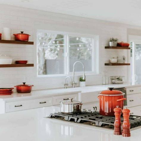 Take notes on our expert's top suggestions and start implementing their guide for a clean and functional space in your kitchen. Organisation, Le Creuset Kitchen, White Cabinetry, Kitchen Upgrades, Residential House, Restaurant Interior Design, Kitchen Cabinetry, Le Creuset, Wood Accents