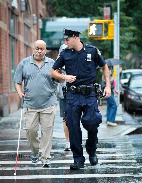 NYPD - Police Officer Joe Pecora helps visually impaired Rod Clemons cross the street Monday during a rain storm.  Even in middle of a crime-scene, one of New York’s Finest finds the time to help bystander Rod Clemons. Rainy Monday, What A Wonderful World, Construction Workers, Human Kindness, Blue Lives, Faith In Humanity Restored, Humanity Restored, Man Up, Faith In Humanity