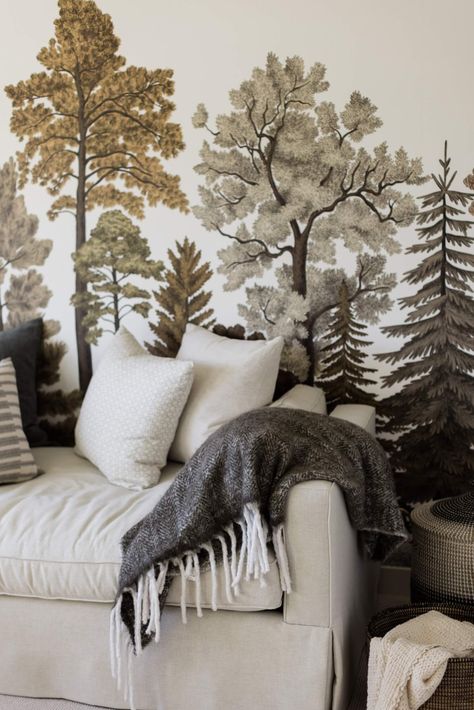 a neutral daybed styled with pillows and a throw blanket against a forest mural in a gender neutral nursery designed by Morris Lare, Des Moines, Iowa Interior Designers Traditional Modern Home, Daybed Styles, Gender Neutral Nursery Design, Modern Traditional Style, Forest Mural, Rooms Design, Nursery Mural, Upholstered Daybed, Interior Wallpaper