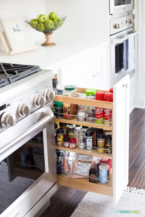 White kitchen cabinets with a pull-out spice rack! Spice Organization Ideas, Pull Out Spice Rack, Kitchen Post, Kitchen Spice Racks, Cottage Kitchens, Kitchen Spices, Coastal Kitchen, Spice Organization, White Kitchen Cabinets