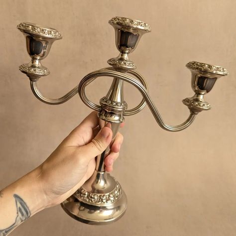 AVAILABLE ✨Silver Plated Ianthe 3-Cup Candelabra, Vintage Mid-Century✨ A lovingly polished silver plated candelabra with twisty arms and floral detailed edges. Likely c. 1950s-70s. In great condition, nice weight. Would look excellent on a mantel or centered on a dining room table. Height: 25.5cm (10") Width: 26cm (10.25") Diameter of base: 10cm (just under 4") 💸 price and more details/photos on website 🇬🇧 FREE UK p+p #collectedvintage #vintageseller #vintagecollection #curatedvintage #ig... Candelabra Vintage, Vintage Interiors, Curated Vintage, Shop Interiors, Table Height, Room Table, Sustainable Living, Dining Room Table, Ceramic Pottery