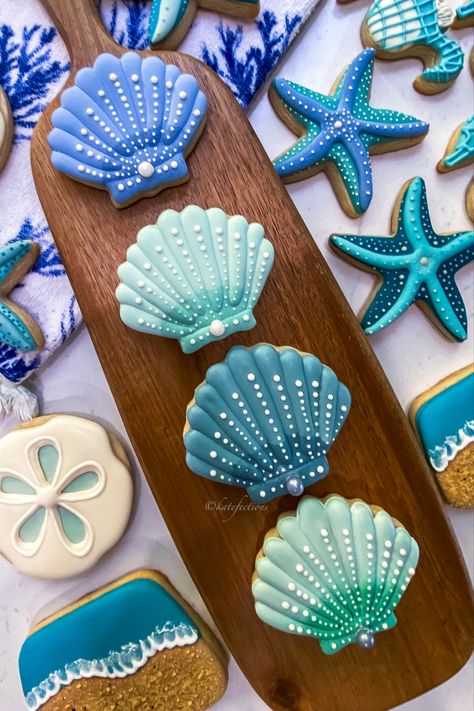 Ocean theme sugar cookies are trending now for baby showers Sea Theme Cookies, Sea Life Cookies Decorated, Under The Sea Decorated Cookies, Ocean Animal Cookies, Beach Wedding Cookies Decorated, Beach Theme Sugar Cookies, Seashell Cookies Decorated, Royal Icing Cookies Designs Summer, Beach Cookies Royal Icing