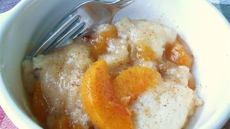 Flour dumplings are added to a peach-infused syrup to create this wonderful, quick-and-easy recipe for Amish peach dumplings. Country Peach Dumplings, Peach Dumplings With Canned Peaches, Peach Dumplings Recipe, Peach Cobbler Dumplings, Authentic Amish Recipes, Peach Dumplings With Pie Crust, Peaches And Dumplings, Amish Recipes Authentic Pennsylvania, Amish Deserts