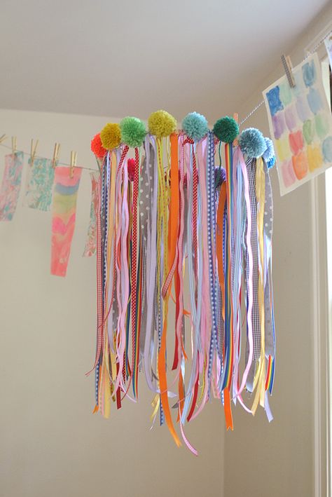 a collaborative chandelier with ribbons and pom-poms made by kids Ribbon Mobile, Ribbon Chandelier, Spring Sewing, Rainbow Ribbon, Diy Pom Pom, Head In The Clouds, Diy Chandelier, Ribbon Art, Craft Projects For Kids