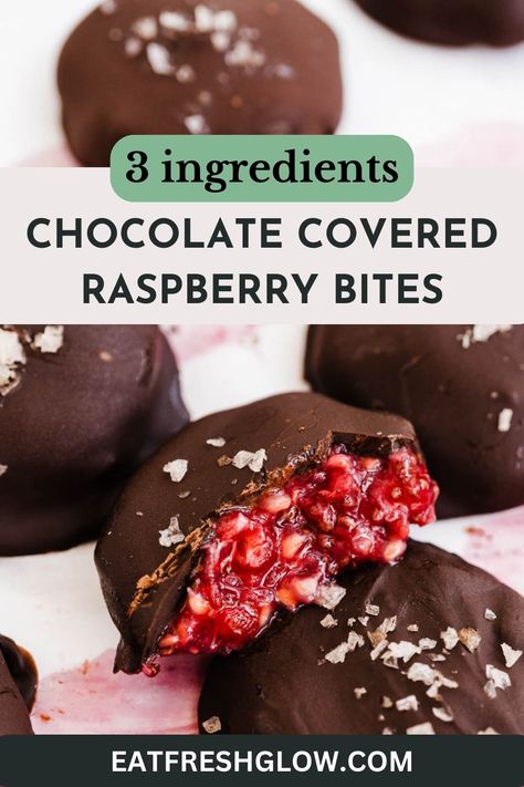 Chocolate raspberry bite cut in half to reveal filling with more bites surrounding. Chocolate Raspberry Yogurt Bites, Raspberry Chia Chocolate Bites, Healthy Dessert Raspberry, Chocolate Raspberry Clusters, Dark Chocolate And Fruit Healthy Snacks, Healthy Raspberry Chocolate Desserts, Raspberry Coconut Balls, Frozen Raspberry Yogurt Bites, Healthy Chocolate Covered Fruit