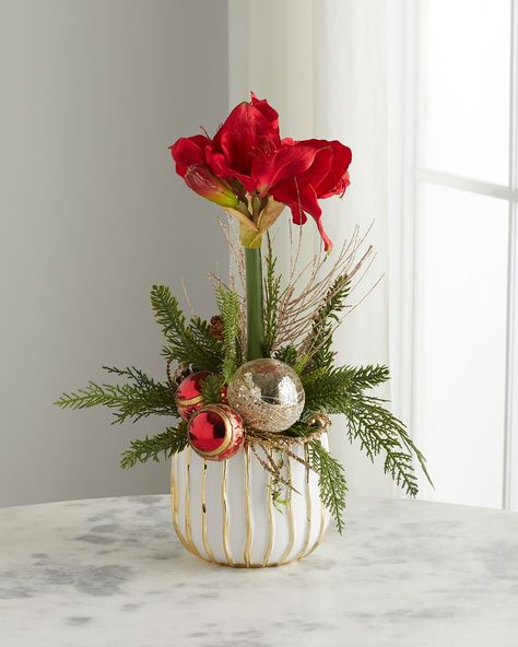 "Find T & C FLORAL COMPANY Single Amaryllis Faux-floral Arrangement on Editorialist. Handcrafted amaryllis faux floral arrangement Made of plastic set in a ceramic vase filled with stones Approx. 12\"Dia. x 24.0\"W Sold individually. Item Weight (Lbs.): 3.0 Wipe clean Made in USA" Winter Floral Arrangements Home, Amaryllis Arrangement Christmas, Xmas Bouquets, Amaryllis Centerpiece, Amaryllis Arrangement, Amaryllis Christmas, Christmas Arrangements Centerpieces, Christmas Floral Designs, Holiday Floral Arrangements