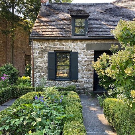 Photo by Nicole Cole | Interior Design in Philadelphia, Pennsylvania. Image may contain: plant, tree, house, flower, outdoor and nature. #Regram via @CDhh_M4js55 Stone House Revival, Stone Cottage Homes, French Country Exterior, Michigan Cottage, Black Front Door, Stone Exterior, Cream Stone, Cottage Exterior, Black Windows