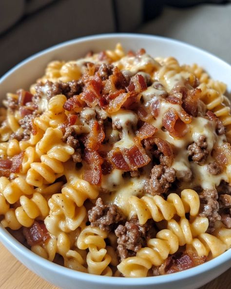 Loaded Bacon Cheeseburger Pasta 🍝🥓🧀 Ingredients: - 1 lb ground beef - 2 cups cooked pasta - 1 cup shredded cheddar cheese - 1/2 cup cooked bacon, crumbled - 1 cup milk - 1/4 cup flour - 1/4 cup ketchup - 1 tablespoon Worcestershire sauce - Salt and pepper to taste Instructions: 1. In a large skillet over medium heat, cook the ground beef until browned and fully cooked. Drain any excess fat. 2. Sprinkle the flour over the cooked beef and stir well to combine. 3. Gradually add the ... Cork Screw Pasta Recipes, Ground Beef Over Rice, Loaded Bacon Cheeseburger Alfredo Pasta, Loaded Bacon Cheeseburger Pasta, Pasta Recipes With Beef, Meat Based Meals, Bacon Dinner Ideas, Beef Cavatappi, Dinner With Pasta