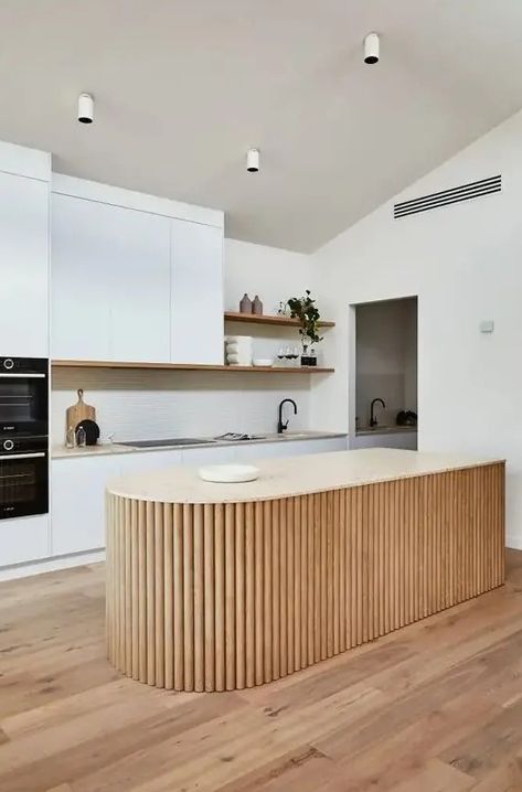 Picture of a white minimalist kitchen with a neutral stone countertop, a curved fluted kitchen island and open shelves Flat Panel Kitchen Cabinets, Panel Kitchen Cabinets, Curved Kitchen Island, White Kitchen Inspiration, Neutral Stone, Curved Kitchen, Kitchen Island Bench, Neutral Kitchen, Minimalist Kitchen Design