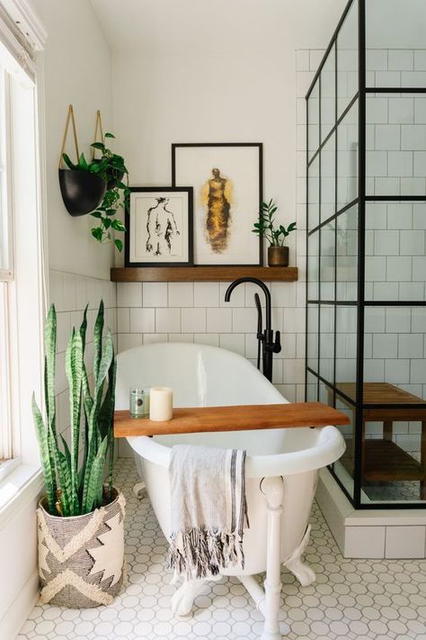 an eclectic bathroom with white square tiles, a free standing tub, a shower space, a shelf with art and potted greenery Eclectic Mid Century Modern Bathroom, European Eclectic Bathroom, Mid Century Boho Bathroom, Historic Airbnb, Master Bath Inspiration, Modern Bohemian Bathroom, European Eclectic, Modern Eclectic Bathroom, Dublin Apartment