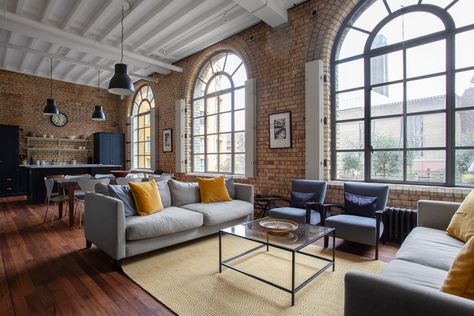 The reimagined warehouse apartment, with an open-plan living space, and master bedroom on one level.... Warehouse Apartment, Manhattan Loft, Warehouse Living, Modern Industrial Interior, Industrial Apartment, Loft Interior, Timber Beams, Industrial Interior Design, Apartment Renovation