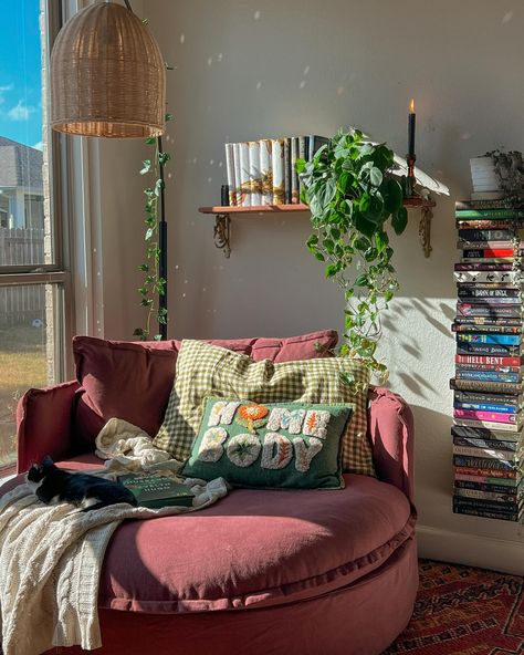 the perfect reading corner doesn’t exi- 🧚🏽‍♀️🍂🎃☕️ guys I love this cozy corner. It’s the perfect size for lounging and reading and naps according to my daughter 😂 I got the @sixpennyhome round daybed in the color summer plum and it’s the perfect pop of color in my room. Thanks to everyone who voted! 🥹 and thank you sixpenny for sending my dream chair over! 💟 update: I am currently in my vampire era and I am enjoying fang fiction! I finished so thirsty & had an amazing time. I have to rea... Small Comfy Chairs For Bedroom Corner, Colorful Reading Corner, Reading Nook Simple, Lounge Room Inspiration, Moody Reading Corner, Cozy Corner Bed Ideas, Chair In Bedroom Aesthetic, Boho Chairs Bedrooms, Book Room Aesthetic Cozy