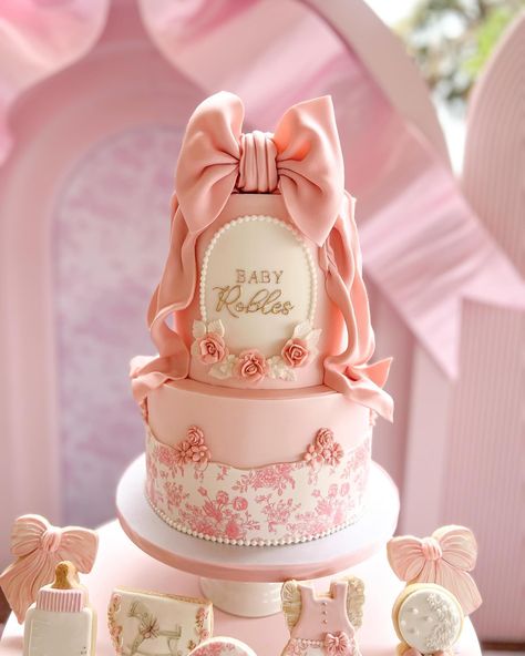 The beautiful designed cake & cookies coordinated perfectly with the decor 🎀🌸 @dandysweettreats never fails to amaze me with her creativity and talent 🤩 #loveshackfancycookies #loveshackfancy #loveshackfancytheme #loveshackfancythemedparty #loveshackfancybabyshower #loveshackfancyparty #loveshackfancybackdrop #loveshackfancybow #bowtheme #bow #floralbabyshower #bowbackdrop #largebow #pinkbow #pinkbowtheme Love Shack Fancy Cake, Pink Bow Cake, Pink Bow Baby Shower Cake, Baby Girl Birthday Cake, Bow Baby Shower, Bow Cakes, Baby Announcement Pictures, Baby Birthday Cakes, Baby Girl Birthday