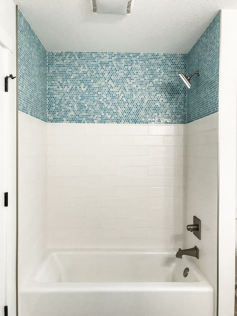 This standard tub insert has been dressed up with white subway tile surround walls and a splash of color is added with the accent tile around the top. Tile Around Tub, Bathtub Tile Surround, Tub Insert, Tile Tub Surround, Bathtub Surround, Shower Inserts, Bathtub Tile, Bathroom Redesign, Tub Surround