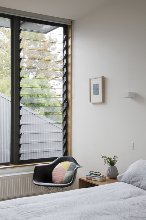 Louvre windows by Breezeway regulate light and air in the master bedroom, which is cleverly tucked in the space beneath the pitched roof. Cube Window, Bedroom Window Design, Master's Bedroom, Jalousie Window, Modern Window Design, Louvre Windows, Louver Windows, Bedroom Decor Design, Modern Windows